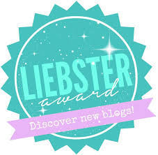 The logo for the Liebster Award is a aqua-blue circle with a pink ribbon across is saying "discover new blogs!".