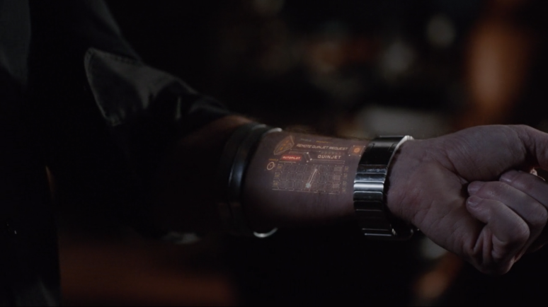 Phil Coulson's prosthetic hand, showing an advanced technological display.