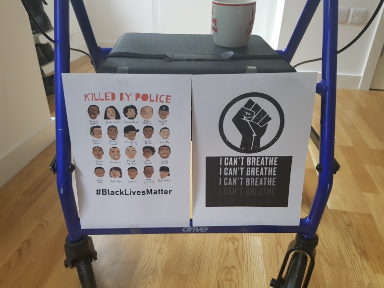 My walking frame covered in protest signs.