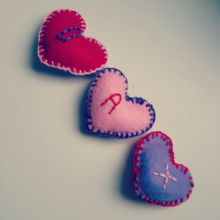 Handmade felt love-hearts with letters on spelling my name.