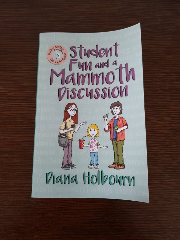 Book 3: Student fun and a mammoth discussion. The same girl is seen conversing with two older students while drinking with a straw from a red cup, on a pale teal cover.